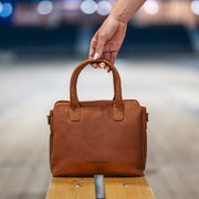 Styled Fit Perspective of Hermosa Full-Grain Leather Handbag 女士 on Model - Natural Daylight Drape
