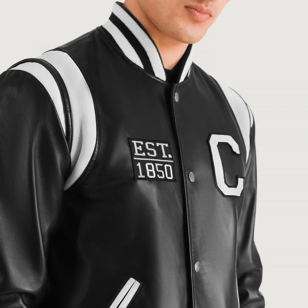 Close-Up Detail of Varsity &amp; Snap Button Hardware on Liberte California 黑色 Leather Varsity 真皮夹克 男士