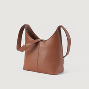 
The Stefani Brown Leather Hobo Bag For Women - 展现立体袖型与合身版型的侧身视角